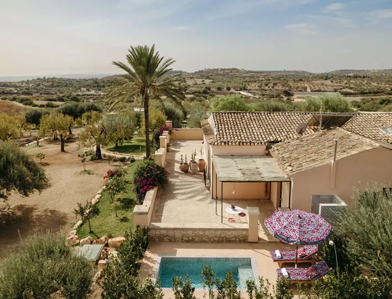 Aerial view of Braccialieri Resort among olive groves in the Val di Noto